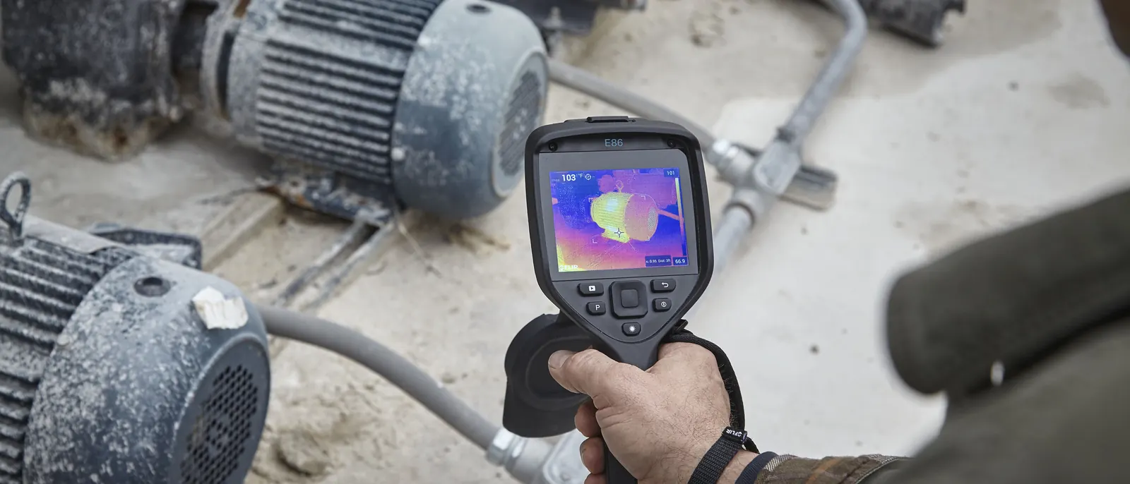 A FLIR E86 checking motor temperatures in a cement plant